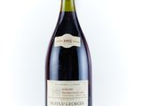a bottle of wine that is sitting on a table
