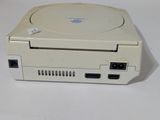 a white nintendo game console sitting on a white table