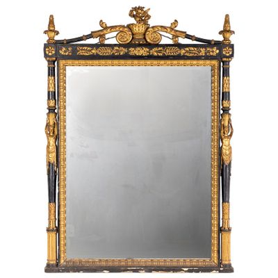 an ornately decorated mirror with gold and black trim