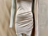 an image of a mannequin dressed in a beige dress