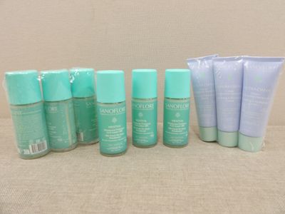 several different types of skin care products are lined up on a table