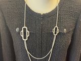 a close up of a mannequin with a necklace on it ' s neck