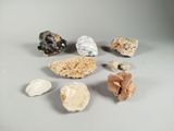 several different types of rocks and stones on a white surface