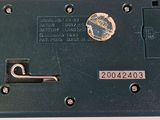 a close up of a metal device on a white surface