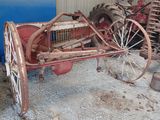 an old tractor that is sitting in a garage