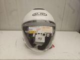 a helmet on a table with a price tag on it
