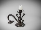 an image of a candle holder with two candles on it