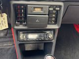 a car dashboard with a radio and other items in it