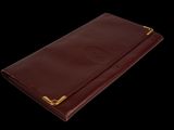 an image of a brown leather wallet on a black background