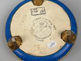 an image of a blue and gold plate with a clock on it