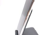 a cell phone that is sitting on top of a stand