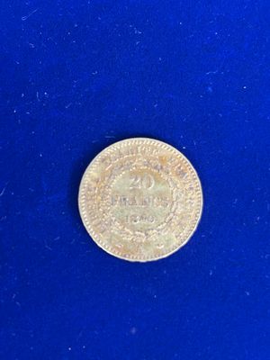 an image of a gold coin on a blue surface
