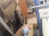 a box of items in the corner of a room