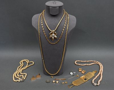 an assortment of jewelry including a necklace, bracelet, and broocher