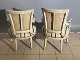 pair of antique chairs with upholstered back and arms