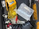 a tool box with tools in it sitting on the floor