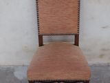 an image of a chair with a brown upholstered seat