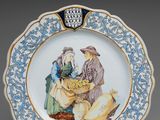 an image of a blue and white plate with a picture of a man and a woman