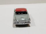 a toy car that is sitting on a white surface