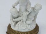a figurine of a boy and a girl on a table