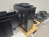 a black computer case sitting on top of a wooden table