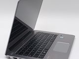 a close up of a laptop computer on a white surface