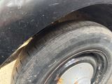 a close up of a car tire with a rusted rim