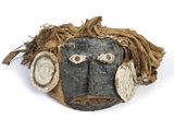 an image of a mask with a face made out of wood