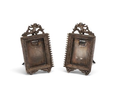 pair of antique silver picture frames with ornate design
