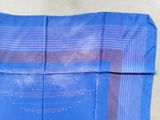 a close up of a piece of blue fabric with a pattern on it