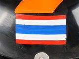 a black helmet with a red, white, and blue stripe on it