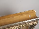 a wooden shelf with a mirror on top of it