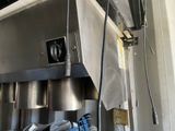 a machine that has a bunch of shoes hanging from it