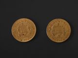two gold coins, one of which is a sovereign and the other of which is a sovereign