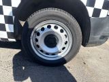 a black and white checkered truck with a flat tire