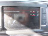 a picture of a car ' s dashboard with the control panel showing