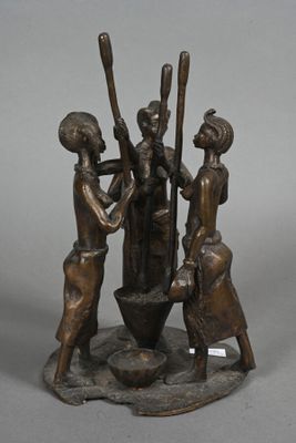 statue of three women with baseball bats and a bowl of water