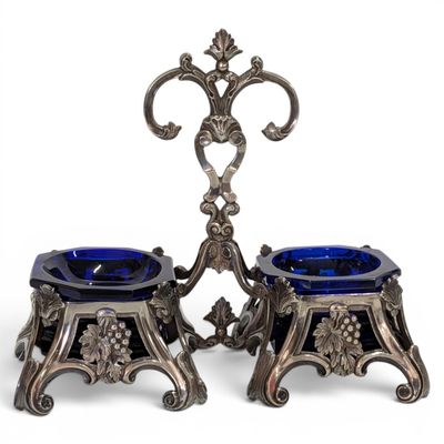 a pair of silver and blue glass candlesticks on stands