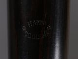 a close up view of a baseball bat with a baseball cap on it
