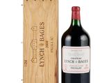 a bottle of wine sitting next to a wooden box