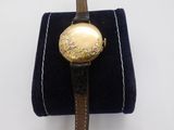 an image of a wrist watch with a floral design on it