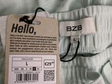 the label on the back of a pair of pants is attached to a tag