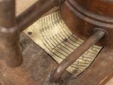 a measuring device that is sitting on a wooden table