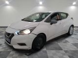 the white car is parked on a checkered floor in the garage