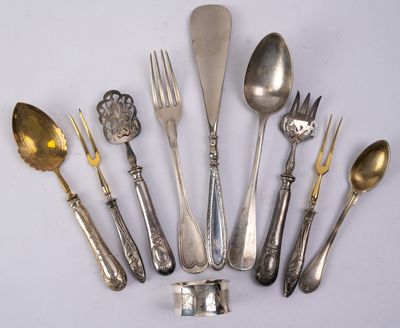 a lot of spoons and forks on the table