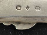 a close up of a knife on a black surface