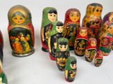 a lot of matry dolls that are lined up together