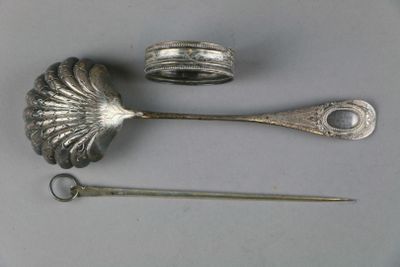 two spoons and a pair of scissors on a table