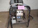 a small machine that is sitting in the garage