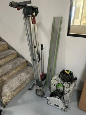 a picture of a room with stairs and a set of skis